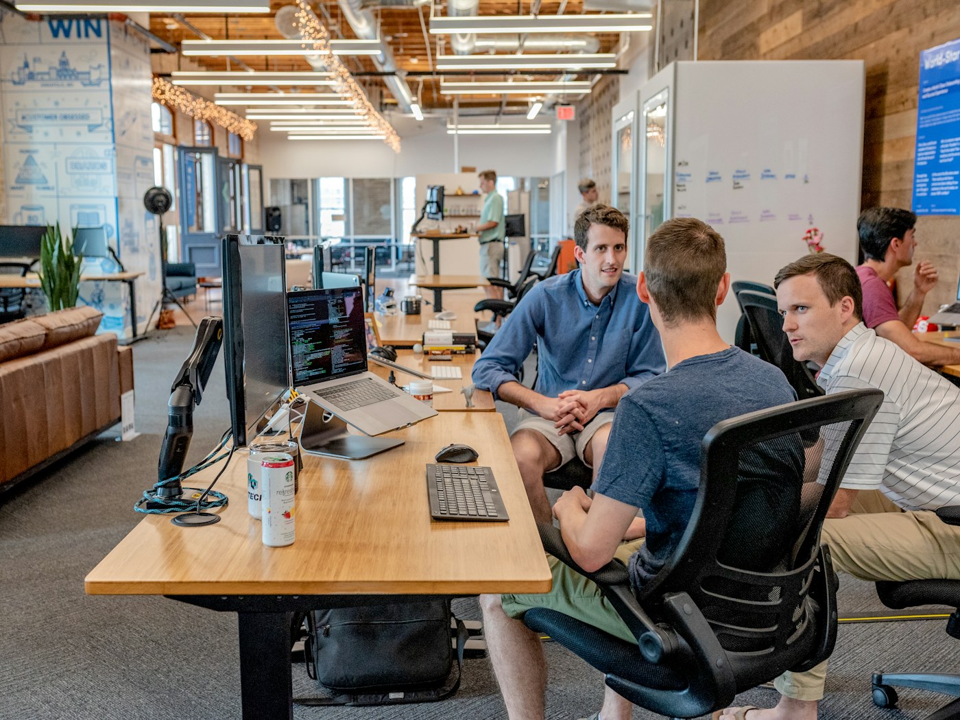 Software and business teams discussing product plans in a modern office